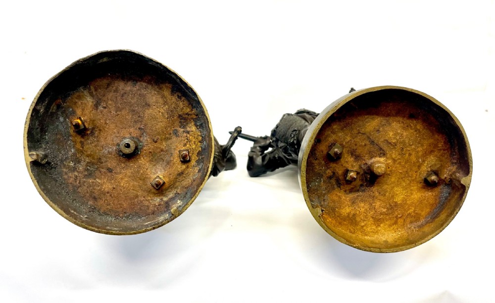 A pair of dark patinated Victorian bronze figures depicting armoured cavalier soldiers standing on circular bases. View XXII