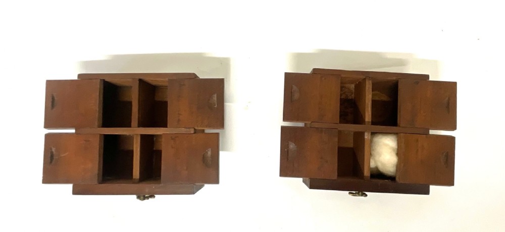 A Georgian dark mahogany apothecary chest with an open hinged lid revealing glass stoppered bottles, a side-hinged door, and interior drawers with brass handles. View XIX