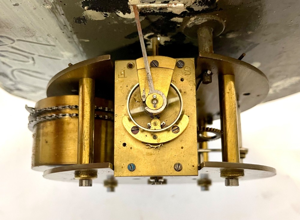 An antique circular nickel-plated brass ships bulkhead clock featuring a cream dial with Roman numerals and a subsidiary seconds dial. View XIII