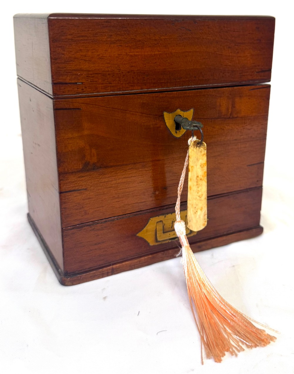 An antique wooden apothecary box shown open with glass stoppered bottles in top compartments and labelled vials in a velvet-lined lower drawer. View VII