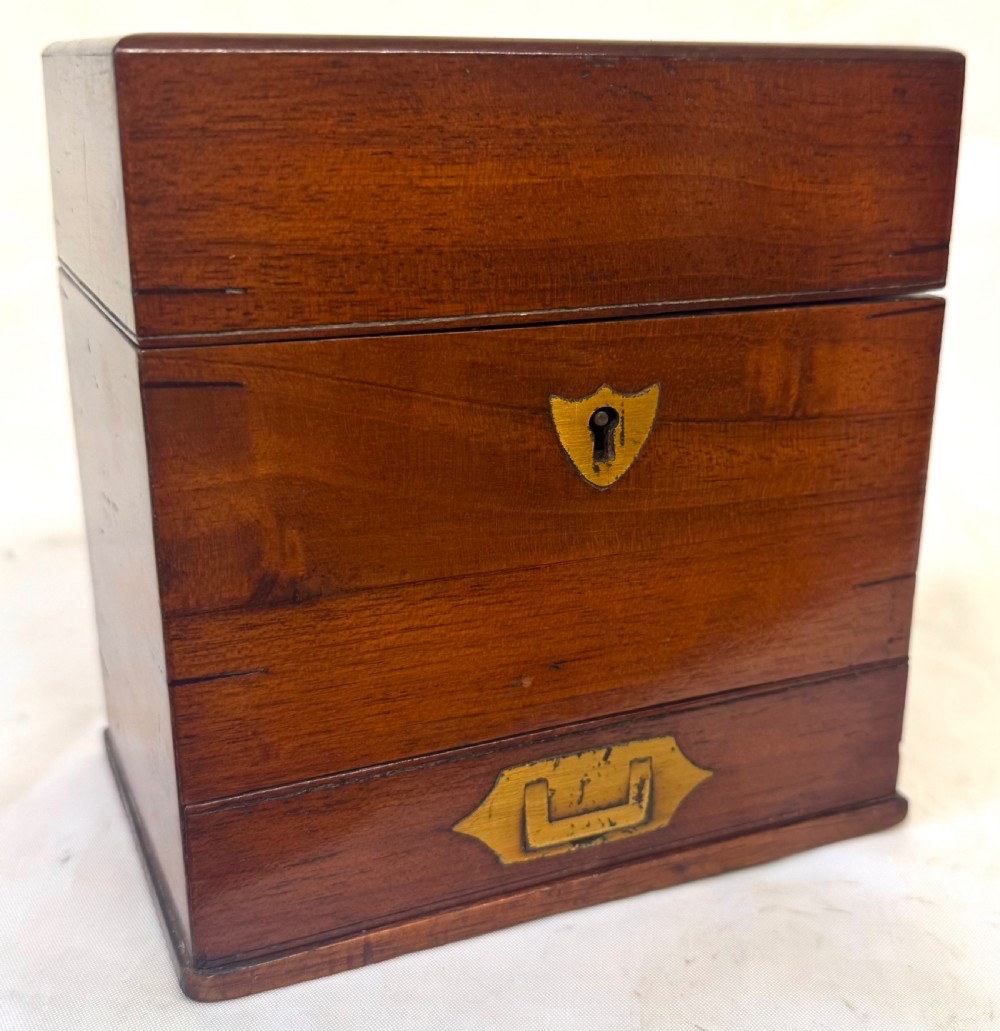 An antique wooden apothecary box shown open with glass stoppered bottles in top compartments and labelled vials in a velvet-lined lower drawer. View VIII