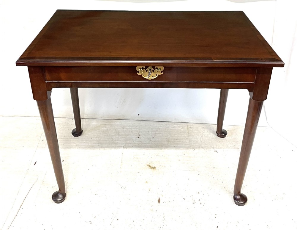 An antique Georgian mahogany side table featuring a rectangular top with a moulded rim, a single drawer with brass hardware, and slender cabriole legs ending in pad feet. View III