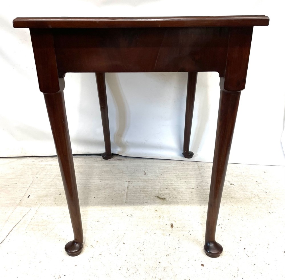 An antique Georgian mahogany side table featuring a rectangular top with a moulded rim, a single drawer with brass hardware, and slender cabriole legs ending in pad feet. View VIII