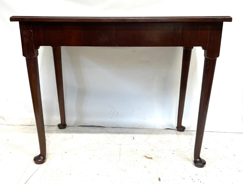 An antique Georgian mahogany side table featuring a rectangular top with a moulded rim, a single drawer with brass hardware, and slender cabriole legs ending in pad feet. View X