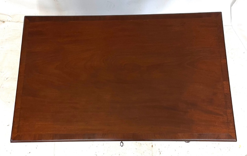An antique Georgian mahogany side table featuring a rectangular top with a moulded rim, a single drawer with brass hardware, and slender cabriole legs ending in pad feet. View XI