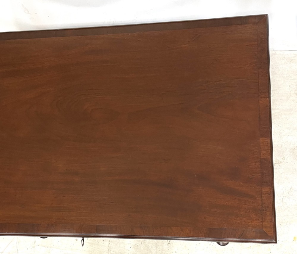 An antique Georgian mahogany side table featuring a rectangular top with a moulded rim, a single drawer with brass hardware, and slender cabriole legs ending in pad feet. View XIII