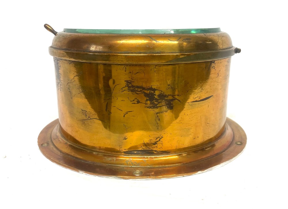 A circular brass-cased ship clock with a white dial displaying black Roman numerals, spade hands, and the maker name Prescot Clock Co. View VIII