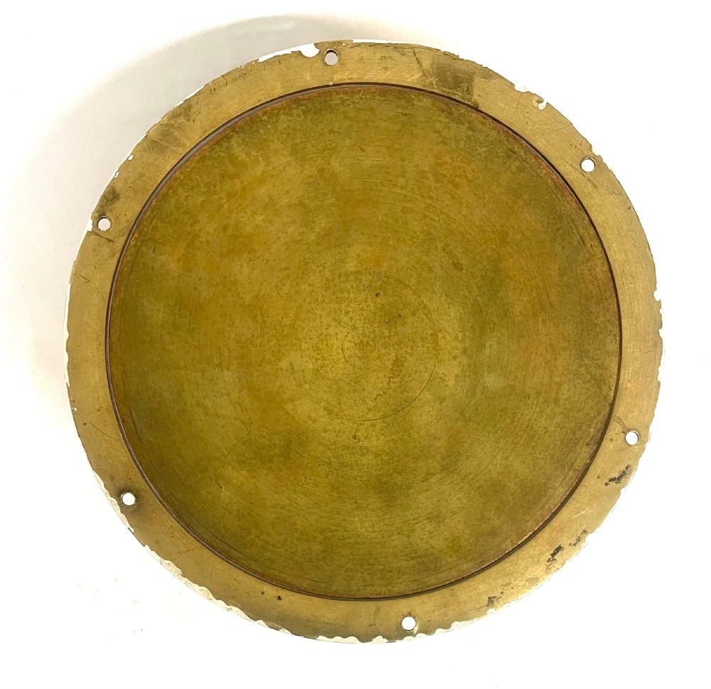 A circular brass-cased ship clock with a white dial displaying black Roman numerals, spade hands, and the maker name Prescot Clock Co. View XII
