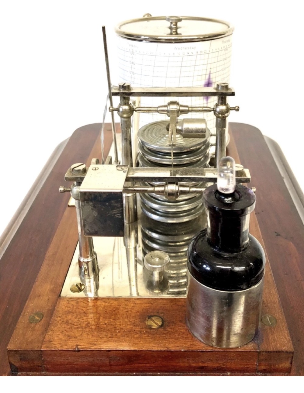 An antique mahogany and glass-cased recording barograph showing internal mechanical brass drums, aneroid pressure cells, and an integrated thermometer above a base drawer. View XII