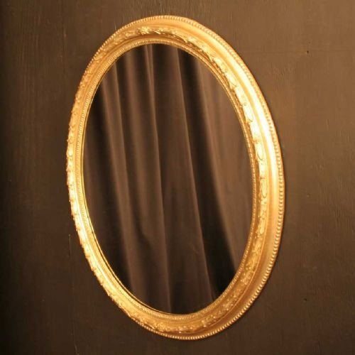 English Oval Giltwood and Composition Mirror