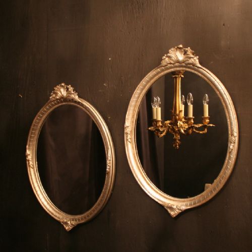 A French Pair of Silver Oval Mirrors