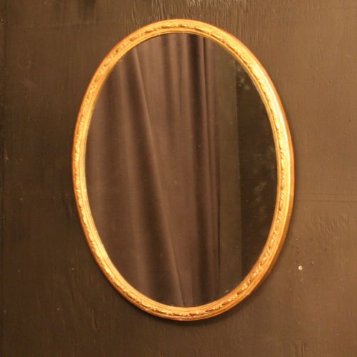 A French Pair of Oval Giltwood Antique Mirrors
