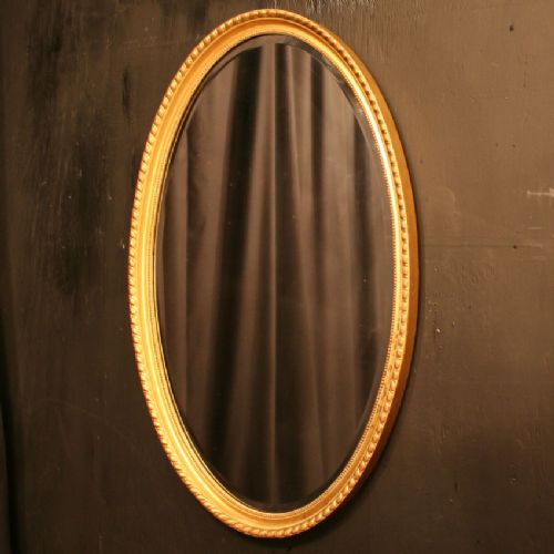 An English Edwardian Giltwood Oval Mirror