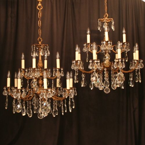 An Italian Pair of 12 Light Double Tiered Antique Chandeliers