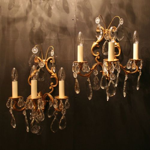 A French Pair of Gilded Cast Twin Arm Antique Wall Lights