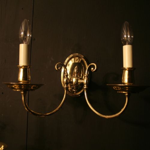 An English Pair of Cast Brass Antique Wall Lights