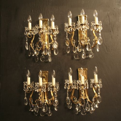 An Italian Set of 4 Triple Arm Gilded Antique Wall Lights