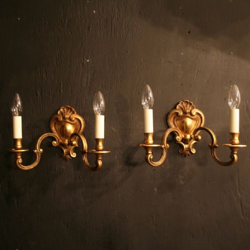 A French Pair of Bronze Twin Arm Antique Wall Lights