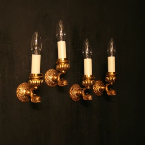 A French Set of 4 Dolphin Gilded Wall Lights