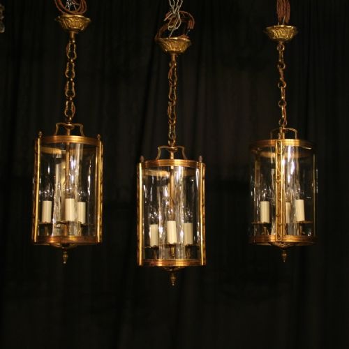 A French Set of Three Gilded Triple Light Antique Lanterns
