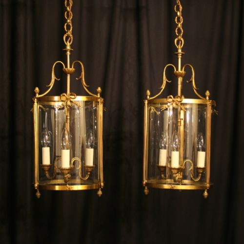A French Pair of Gilded Triple Light Convex Antique Hall Lanterns