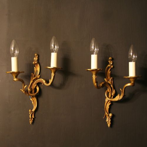A French Pair of Bronze Twin Arm Antique Wall Lights