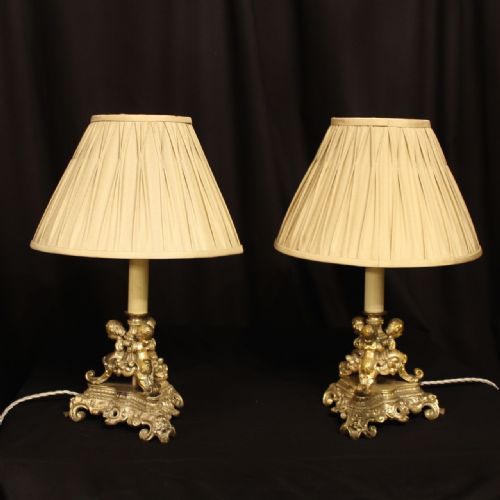 A French Silver Gilded Cherub Table Lamps