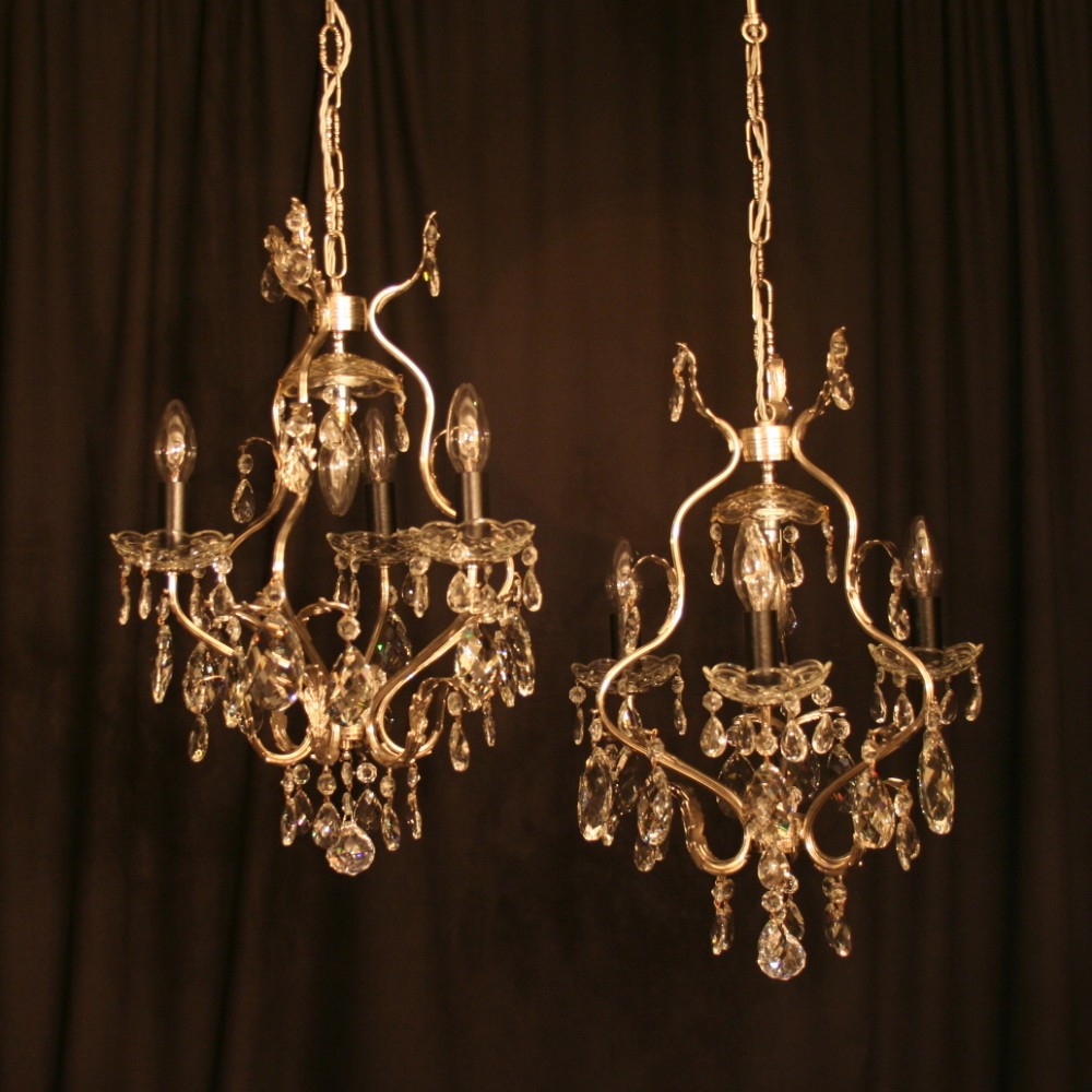 An Italian Pair Of Silver Antique Chandeliers