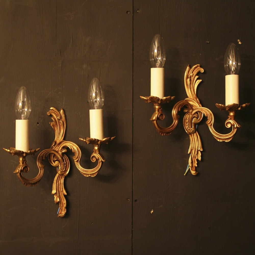 A French Pair Of Gilded Twin Arm Wall Lights