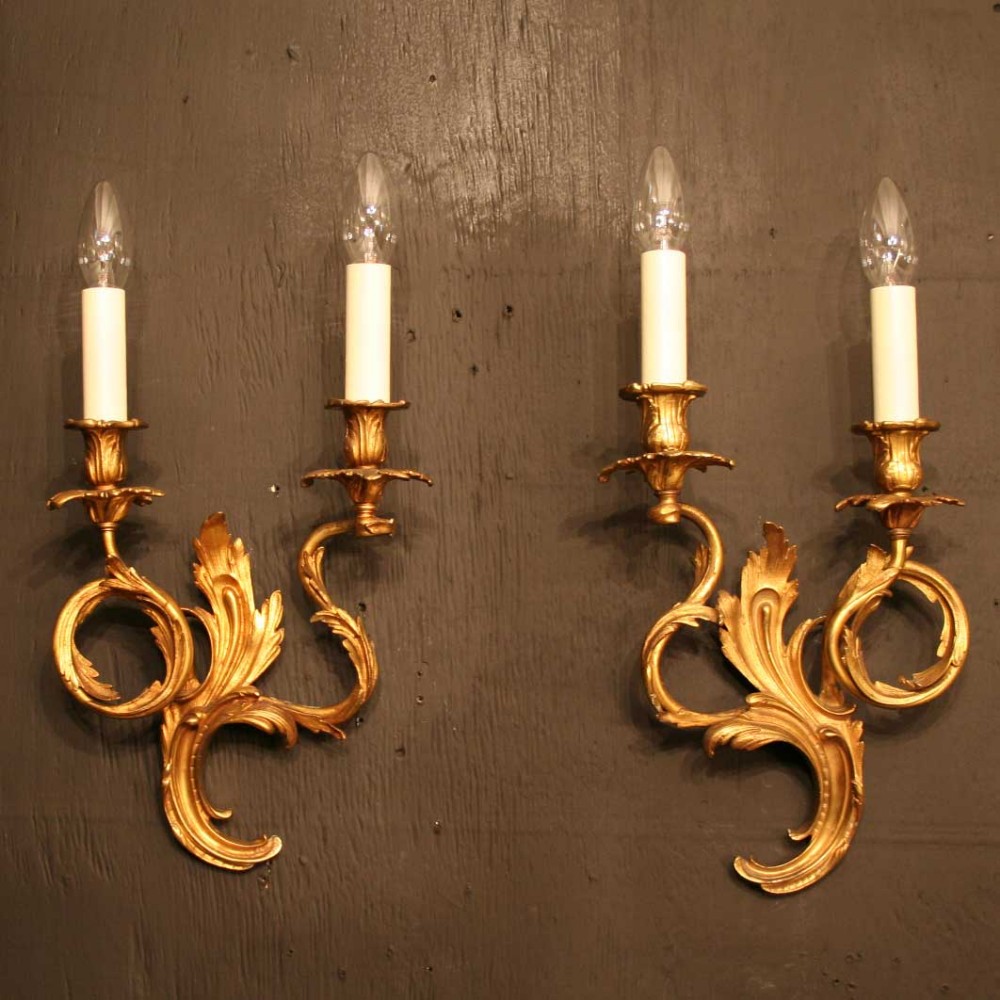 A French Pair Of Gilded Bronze Twin Arm Antique Wall Lights