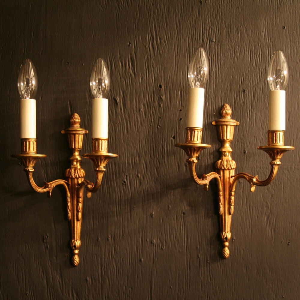 A French Pair Of Gilded Twin Arm Wall Lights