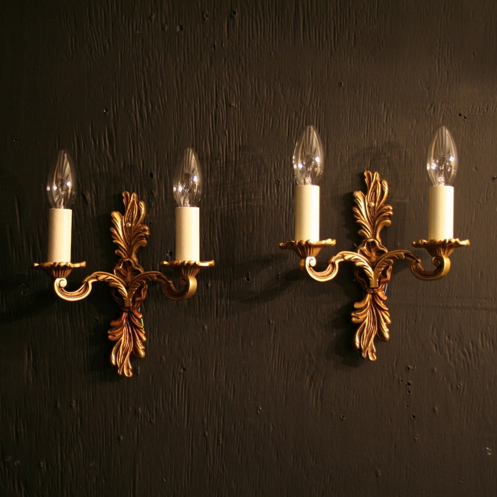 A French Pair Of Gilded Twin Arm Wall Lights