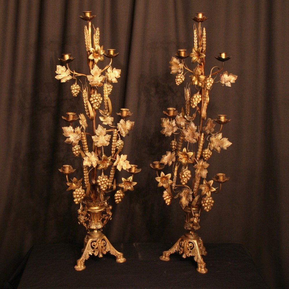 A French Pair Of Gilded Antique Candelabra