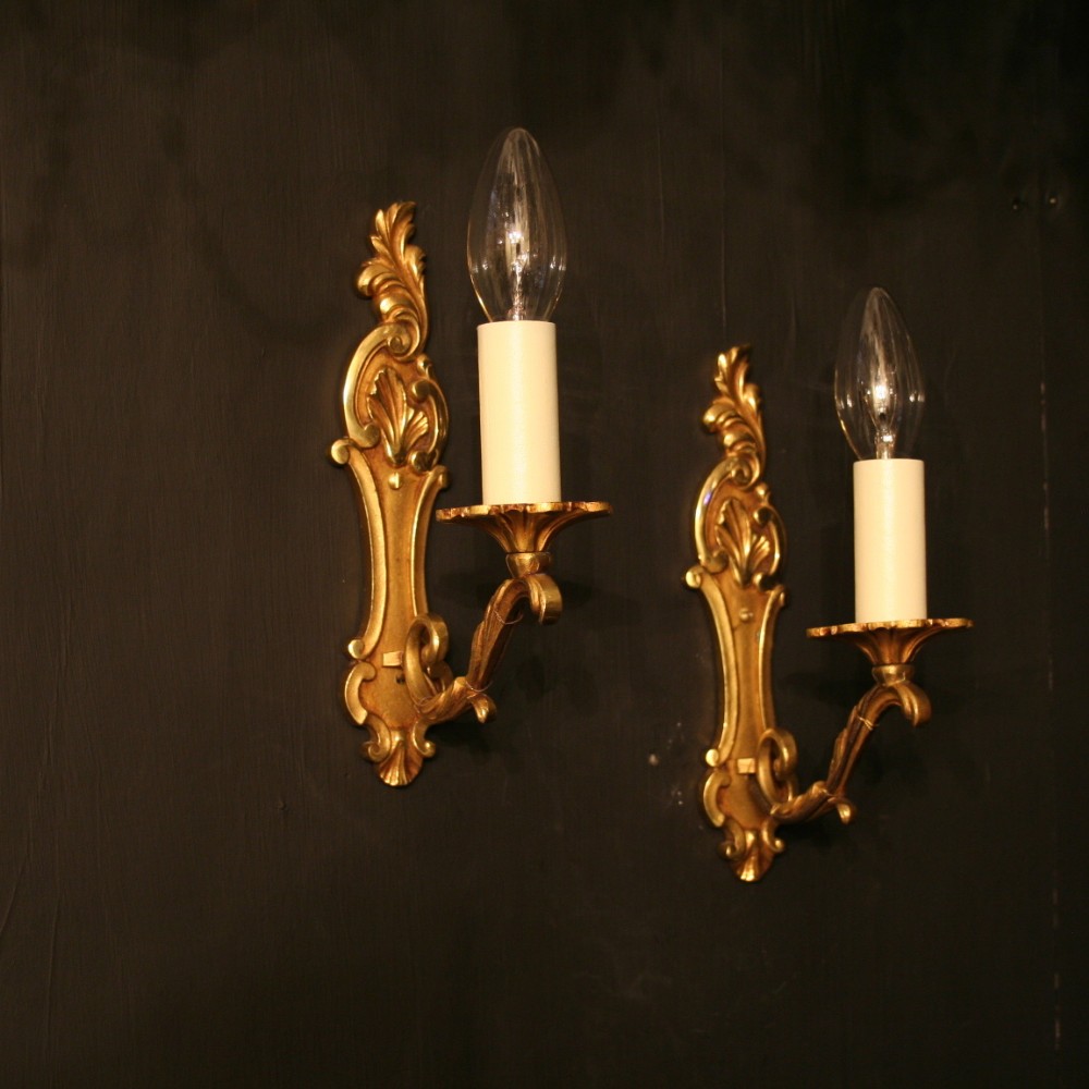 A French Pair Of Single Arm Antique Wall Lights