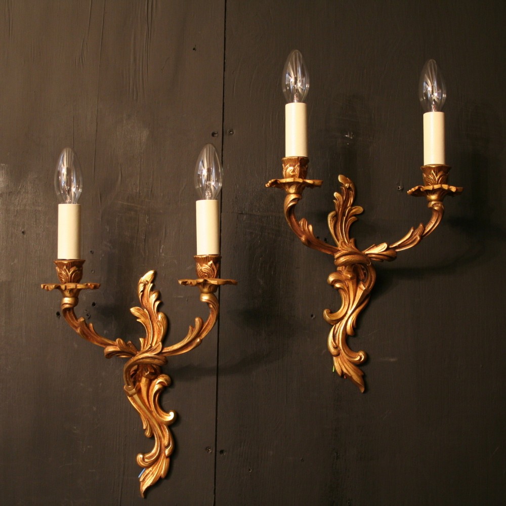 A French Pair Of Gilded Twin Arm Antique Wall Lights
