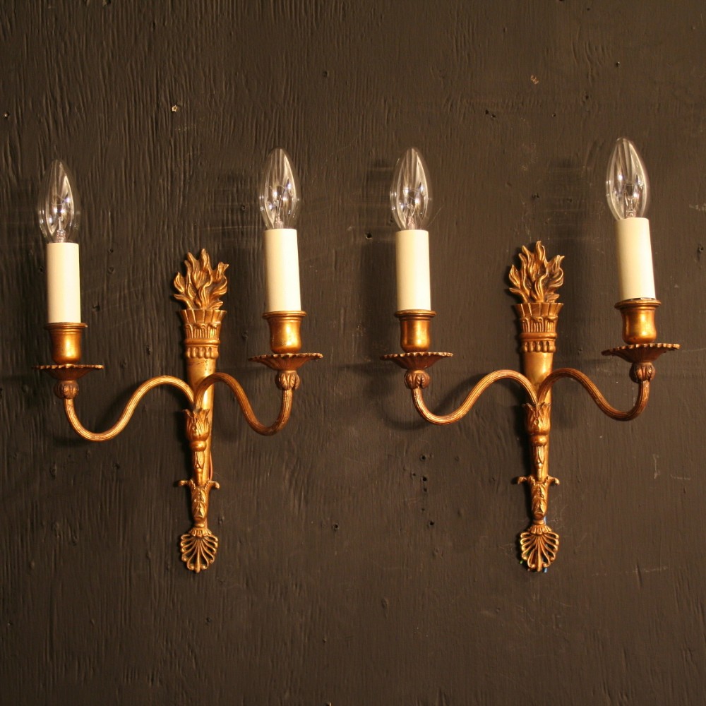 A French Pair Of Gilded Flame Twin Arm Antique Wall Lights
