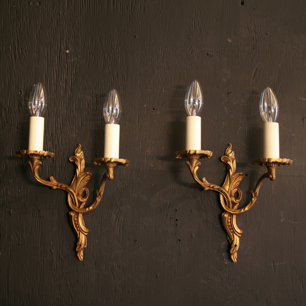 A French Pair Of Gilded Cast Brass Twin Arm Antique Wall Lights