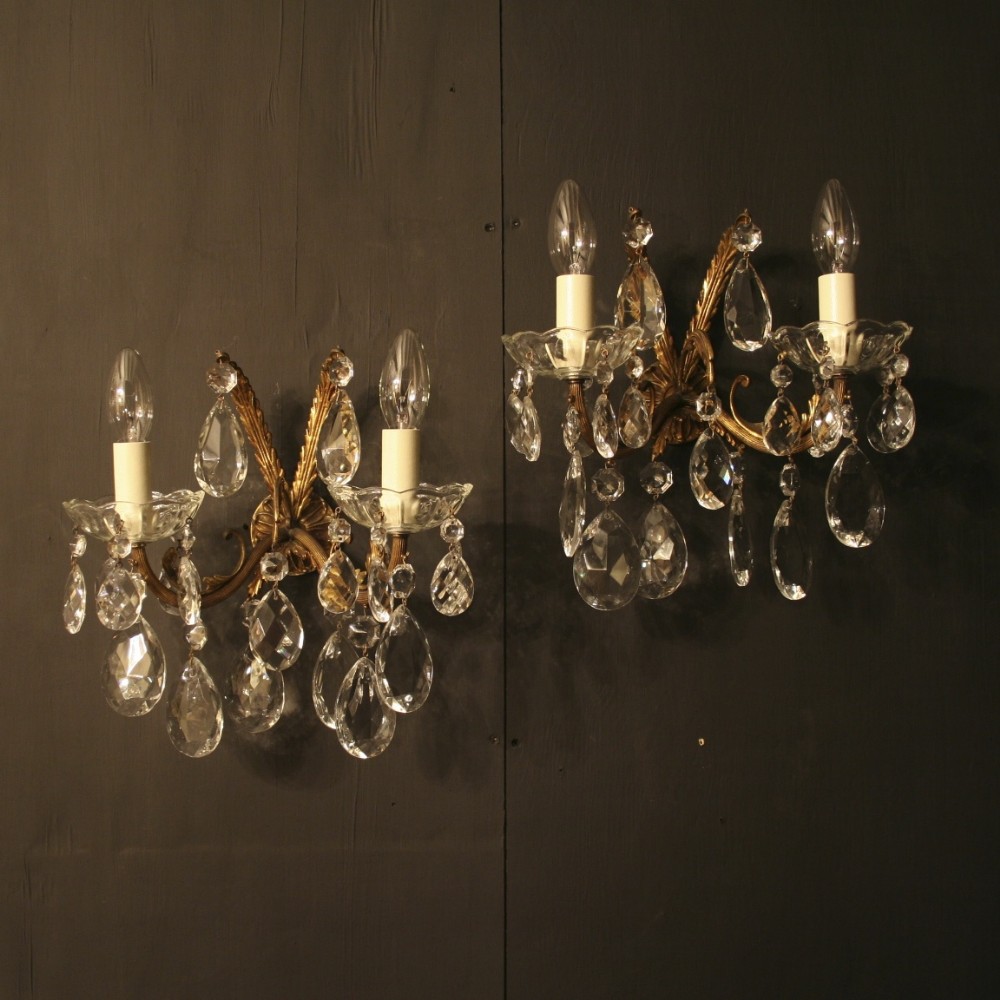 A French Pair Of Gilded Twin Arm Antique Wall Lights
