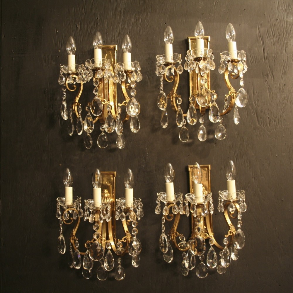An Italian Set Of 4 Triple Arm Gilded Antique Wall Lights