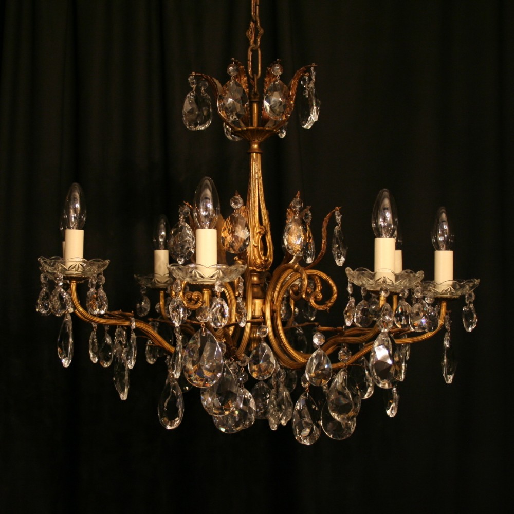 An Italian 8 Light Gilded Cast Antique Chandelier