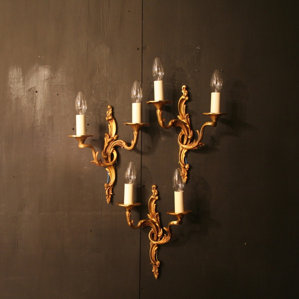 A French Set Of Three Bronze Twin Arm Antique Wall Lights