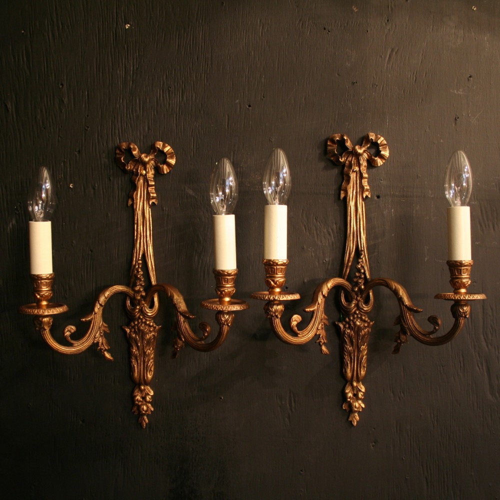 A French Pair Of Gilded Ribbon Antique Wall Lights