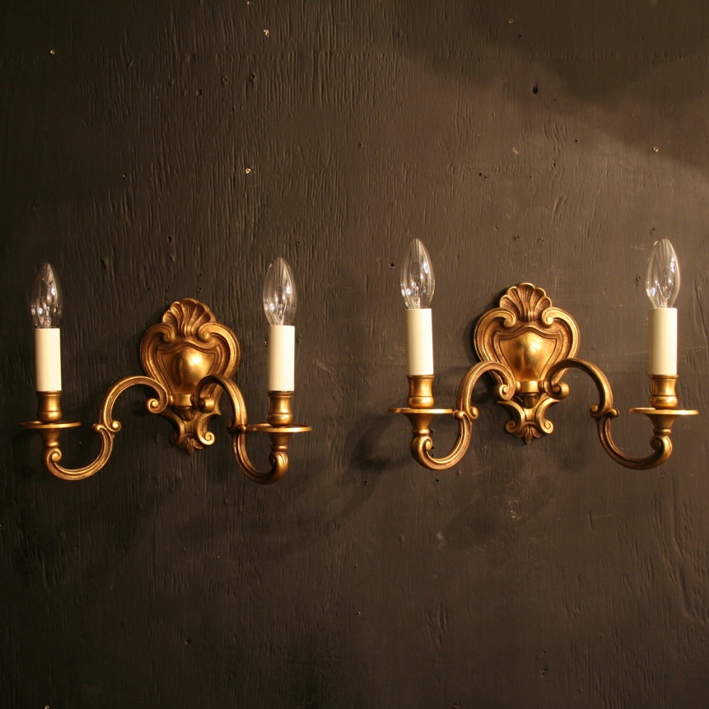 A French Pair Of Bronze Twin Arm Antique Wall Lights