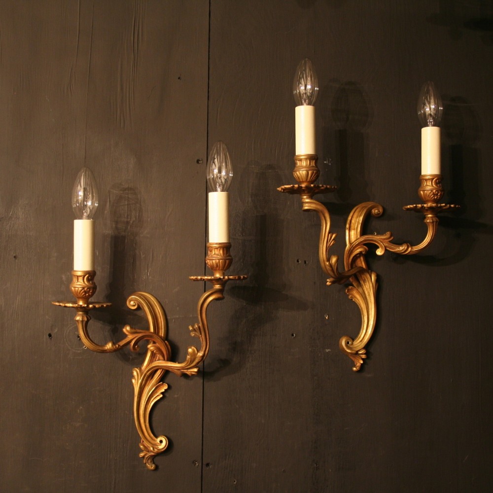 A French Pair Of Gilded Twin Arm Wall Lights