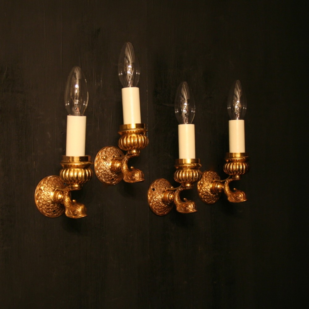 A French Set Of 4 Dolphin Gilded Wall Lights