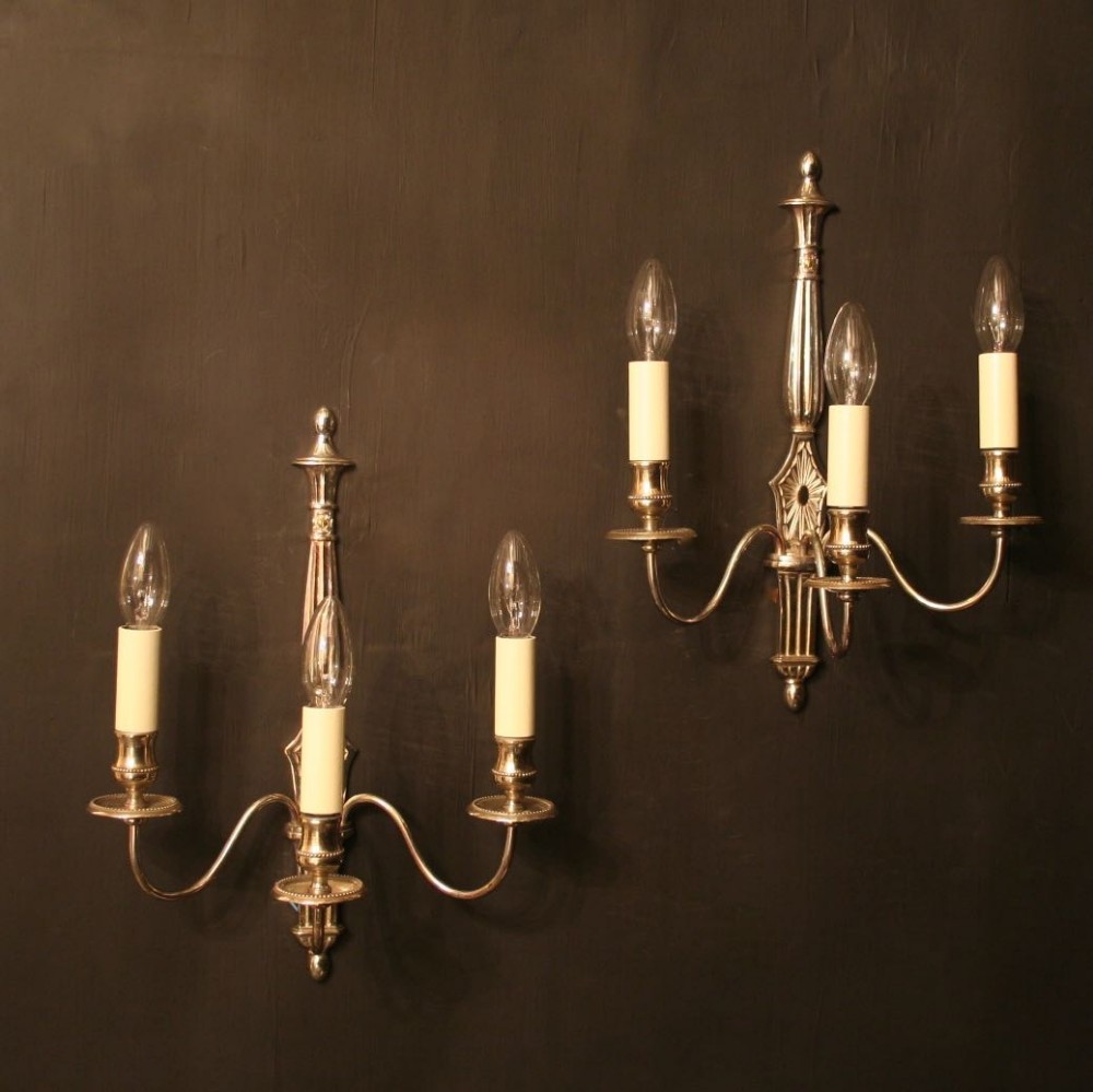 A French Pair Of Silver Triple Arm Wall Lights
