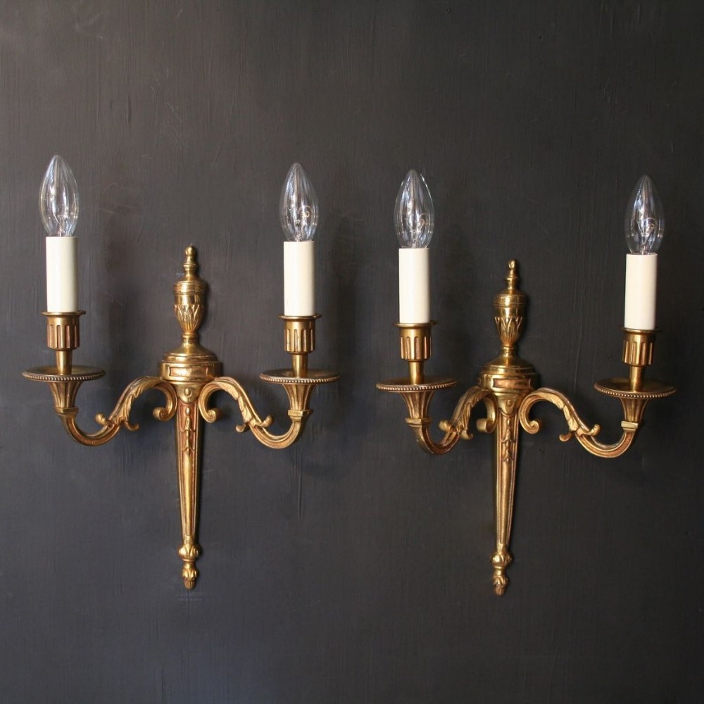 A French Pair Of Gilded Twin Arm Wall Lights