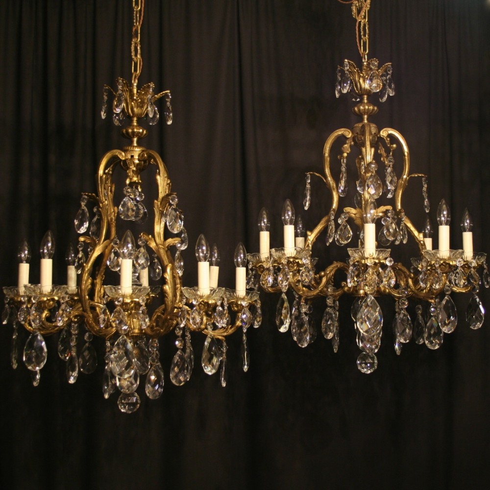 A French Pair Of Gilded Antique 8 Light Cage Chandeliers
