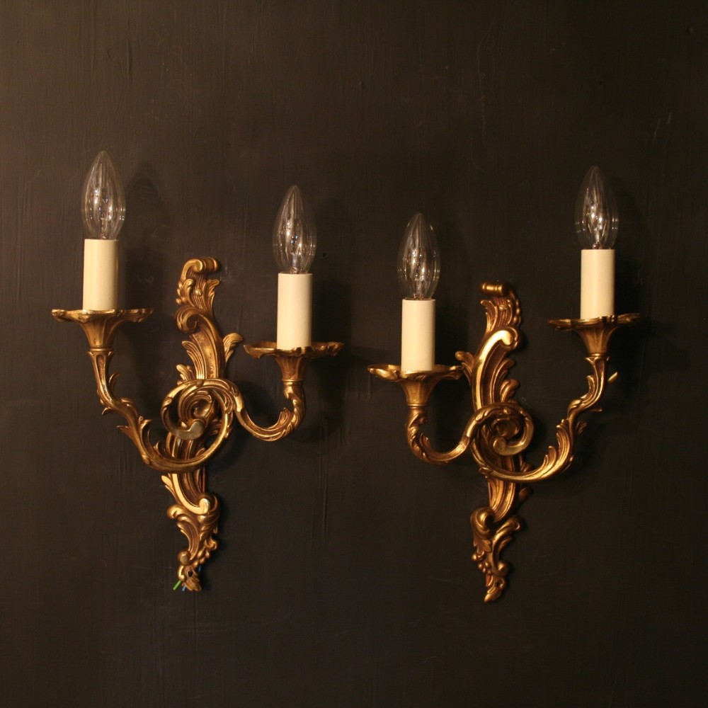 A French Pair Of Gilded Twin Arm Wall Lights