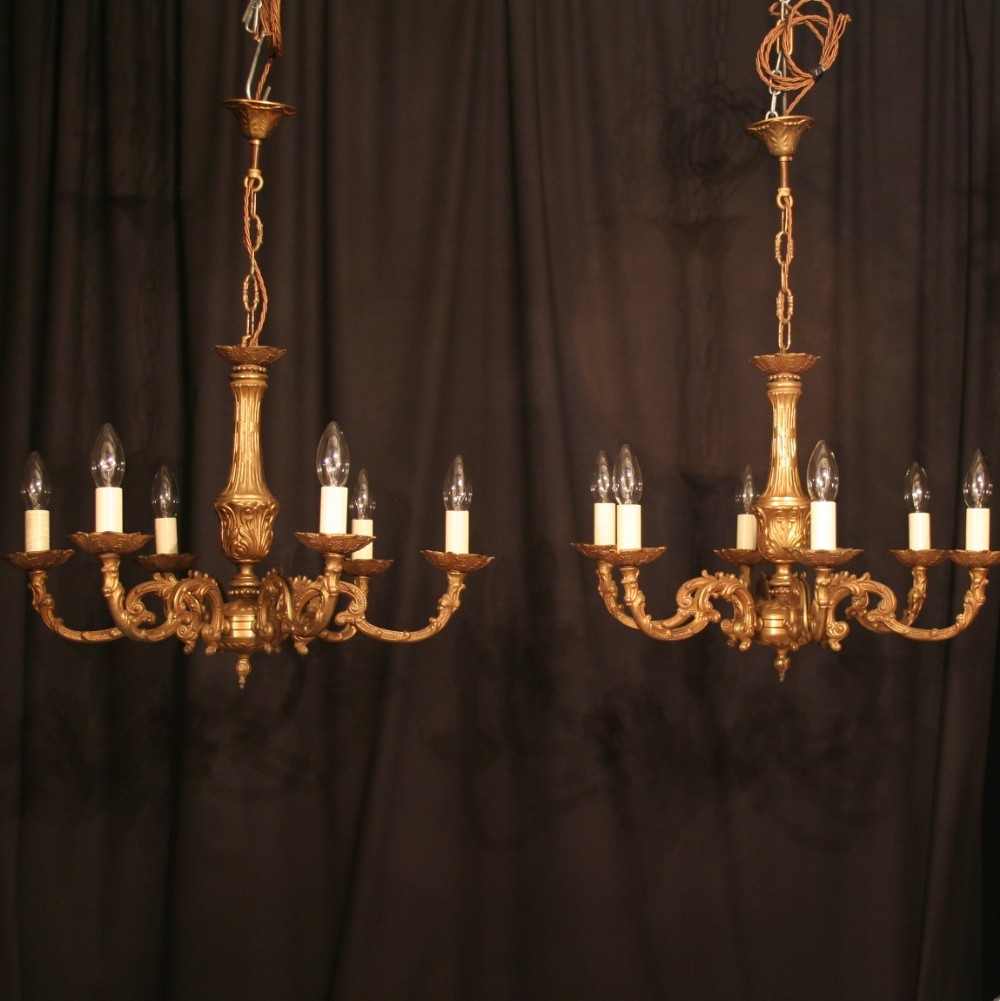 A French Pair Of Gilded 6 Light Chandeliers